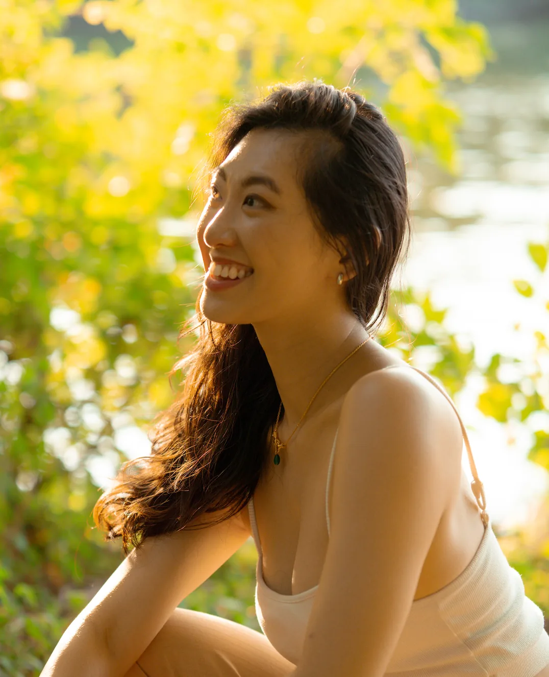 Ashley smiling outdoors in the sun